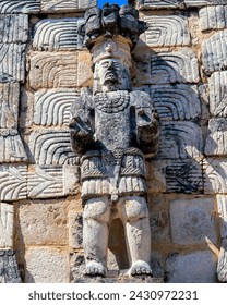 Statue of a man with strong hands in Codz Poop : Kabah, Yucatan, Mexico