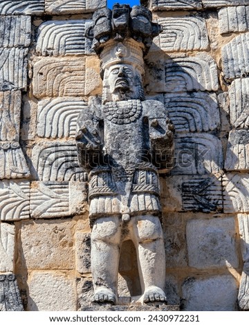 Statue of a man with strong hands in Codz Poop : Kabah, Yucatan, Mexico