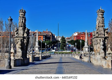Statue Of Maria Torribia (right) And Statue Of Isidore The Laborer (left) On Bridge Of Toledo (Puente De Toledo), A Baroque Style Bridge Spans The Manzanares River, Madrid, Spain