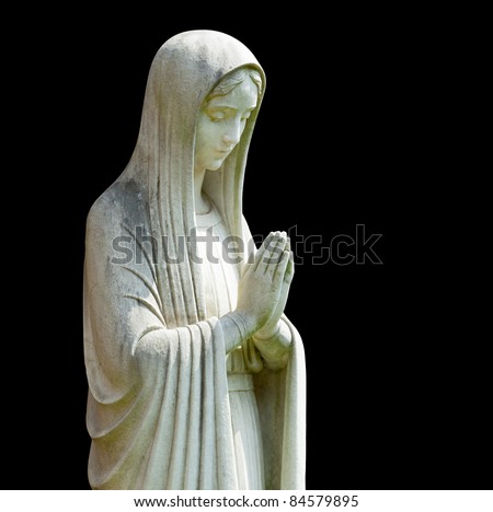 Statue of Mary praying in profile with isolation path and isolated against black