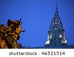 Statue of Mercury at Grand Central Terminal in New York City, with the Chrysler Building in the background