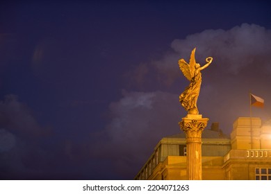 Statue Near Rudolfinum Concert Hall At Night In Prague, Czech Republic.