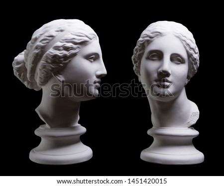 Statue. On a black isolated background. Gypsum statue of Aphrodite's head. 