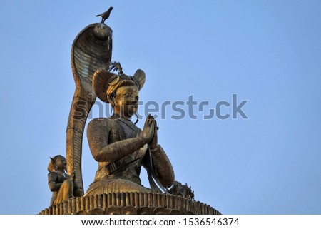 Statue on a column in Durbar Square in Kathmandu, Nepal                               