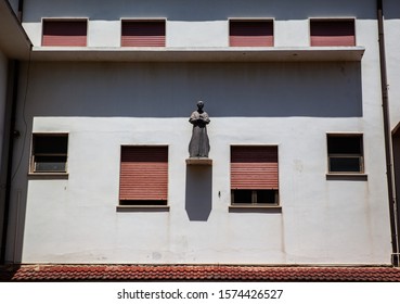 A statue on the facade or the building