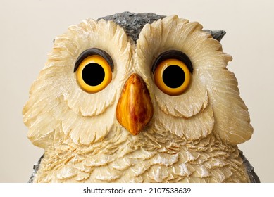 Statue of an Owl isolated on bright background. Close up.