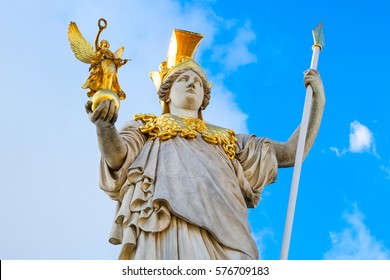 Statue of Pallas Athena in golden helmet near Parliament , Vienna, Austria