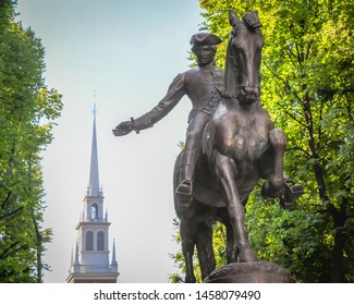 A statue of Paul Revere on horseback, near the Old North Church where lanterns were hung warning him of the incoming British by land or sea.