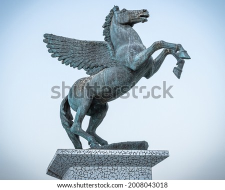 A statue of Pegasus, the Mythical Winged Horse, emblem of the city,  Pegasus square in Corinth Peloponnese.