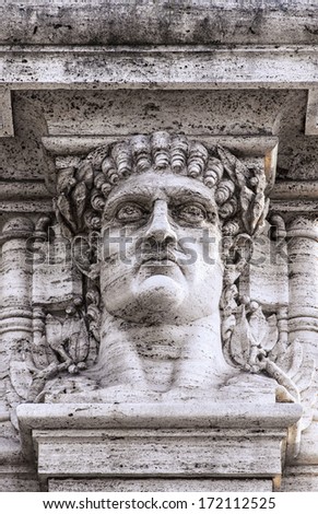 A statue relief of emperor Nero's head on the gateway entrance to the park that contains the ruins of his golden palace at domus aurea in Rome.