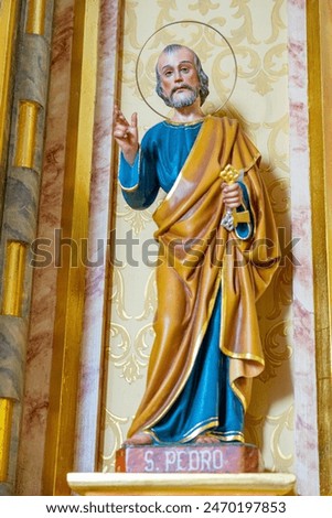 Statue representing Saint Peter inside the church of Fajã de Santo Cristo. Statue of a saint, the shepherd children and the sheep representing the apparitions of Our Lady of Fatima 