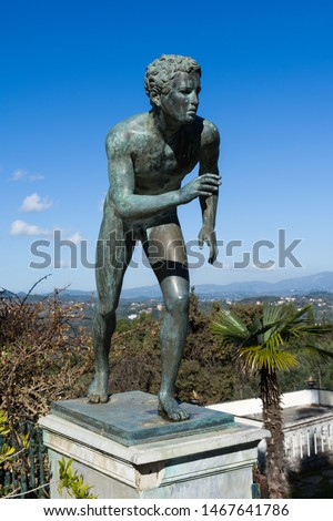 A statue of The Runner in the garden of Achilleion palace in Corfu Island, Greece, built by Empress of Austria Elisabeth of Bavaria, also known as Sisi.