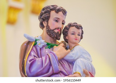 Statue Of Saint Joseph With Child Jesus In Catholic Church