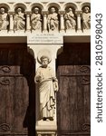 Statue of Saint Peter at the center of the main portal on the principal façade of the Saint Peter’s Church in Mâcon 
