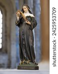 Statue of Santa Rita de  Cassia in blurred religious church background