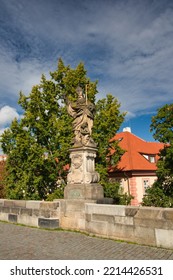 Statue Of St. Augustine On Charles Bridge, Prague. Czech Republic	