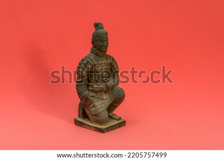 statue terracotta warrior and red background
