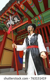 Statue Of A Traditional Korean Soldier In Front Of A Gate At The Jinju Fortress In South Korea. The Fortress Played A Pivotal Role During The Japanese Invasion Of The Peninsula In The 16th Century.