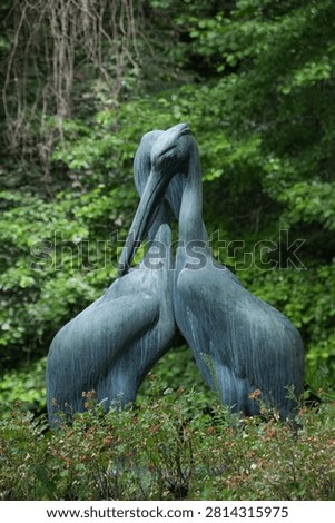 Statue of two cranes together
