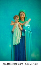 Statue Of Virgin Mary Holding The Baby Jesus.