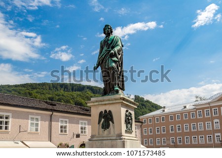 The statue of  Wolfgang Amadeus Mozart in Salzburg in a beautiful summer day, Austria