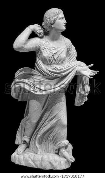 Statue of a woman in the antique style on the\
isolated black background. Ancient stone female sculpture.\
Classical art object