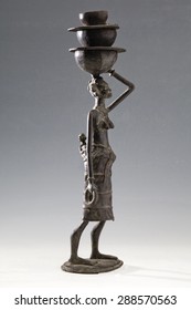 Statue Of A Woman Carrying Water On Her Head And Her Son, Ancient African Art