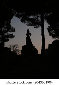 the statue is sunset