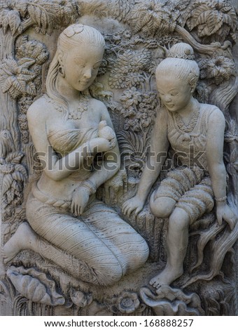 Statue of a woman. Thai ancient stone carving