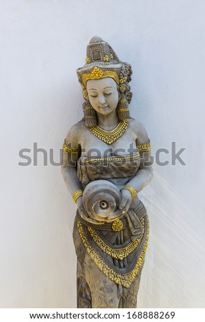 Statue of a woman. Thai ancient stone carving