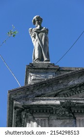 Statuee Of Cementery In The Corner