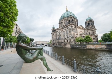 Statues along the Spree river bank opposite the Berlin Cathedral