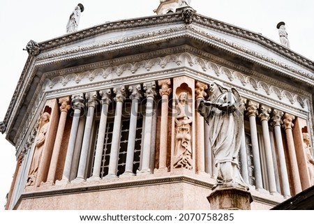 Statues of angels in front of the baptistery of the Basilica of Santa Maria Maggiore. Bergamo, Italy