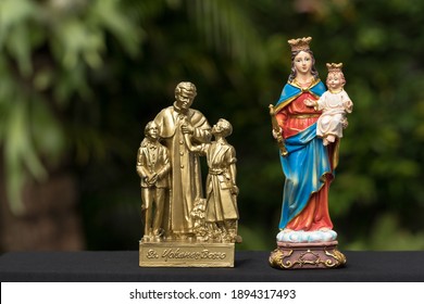 The Statues Of Don Bosco And Mary Help Of Christians.