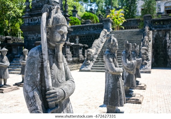 Statues of warriors in Imperial Khai Dinh Tomb in\
Hue, Vietnam