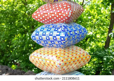 Statuette of stack of mosaic colorful pillows. Landscape Park with modern sculptures and installations made by Konstantin Skretutskiy. Kiev, Ukraine, Landscape Alley 
 - Powered by Shutterstock