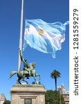 Staute of General Manuel Belgrano in front of Casa Rosada in Buenos Aires Argentina with the argentinian flag