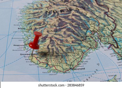 Stavanger Marked With Red Pushpin On Map. Selected Focus On Stavanger And Bright Red Pushpin. Pushpin Is In An Angle. Southern Parts Of Norway Can Be Seen On Map.