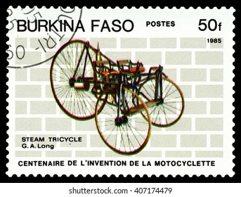 STAVROPOL, RUSSIA - MARCH 16, 2016: a stamp printed in Burkina Faso, shows   Steam Tricikle, G. A. Long,  stamp devoted to the centenary of the invention of motorcycle , circa 1985