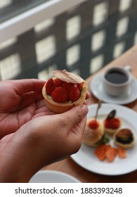 Stawberry Mini Pie Holding By A Girl Hand.