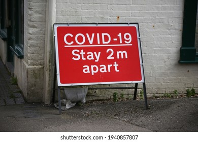 Stay 2 Metres Apart Sign In High Street In The UK