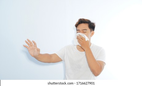 Stay Away From Me, Please. Sick Casual Man Coughing Or Sneezing Isolated On White Background. Social Distancing Concept.