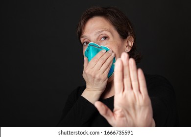 Stay Back - Woman With Hospital Grade Mask With Hand Up Keeping People Away From Her