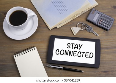 Stay Connected. Text On Tablet Device On A Wooden Table