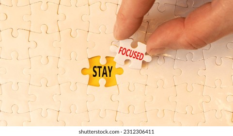Stay focused symbol. Concept words Stay focused on beautiful white puzzles on beautiful white background. Businessman hand. Business support motivation psychological stay focused concept. Copy space - Shutterstock ID 2312306411