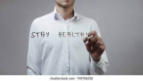 Stay Healthy , Man Writing On Glass