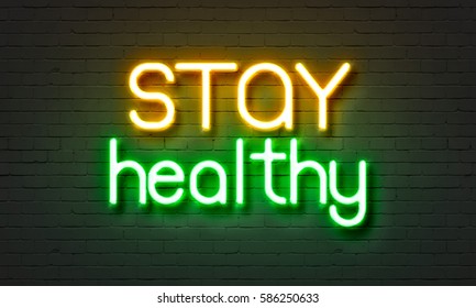 Stay Healthy Neon Sign On Brick Wall Background