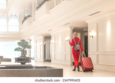 Stay Here And Feel Like Home. Attractive Businesswoman Arriving At Luxury Hotel. Copy Space On The Left Side