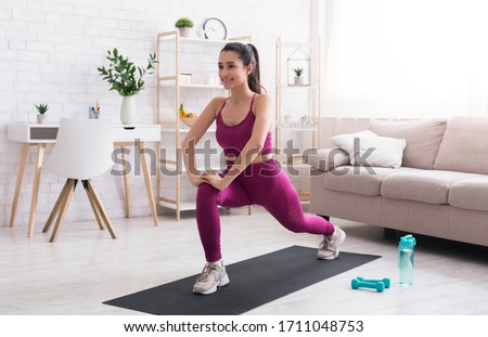 Stay home, stay active. Hispanic girl doing cardio workout in living room