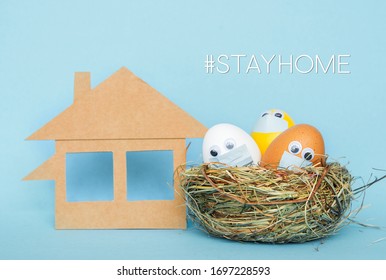 Stay Home At Easter Holiday, Easter Colored Eggs In Face Mask And House Quarantine Concept Celebrate Safely During Coronavirus  Pandemic